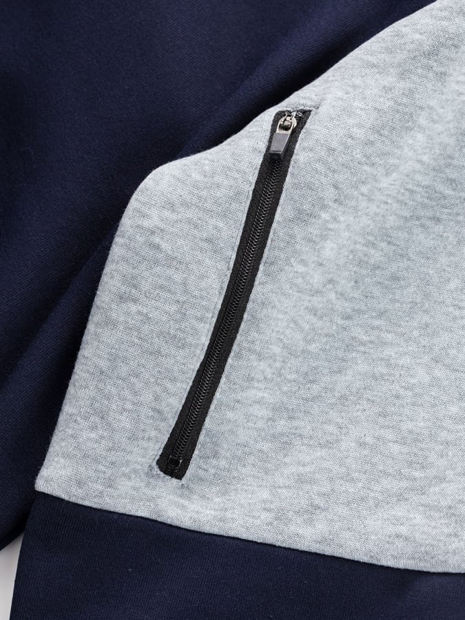 Men's Vintage Outdoor Style Patchwork Design Sweatshirt with Zipper Pockets.