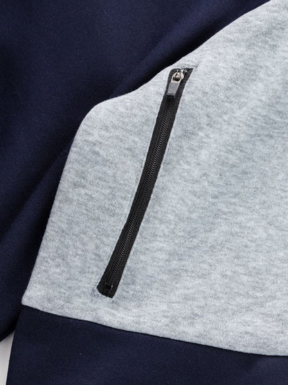 Men's Vintage Outdoor Style Patchwork Design Sweatshirt with Zipper Pockets.